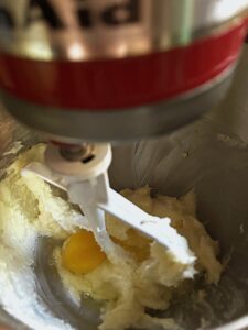 Add eggs into the batter and vanilla and sour cream.
