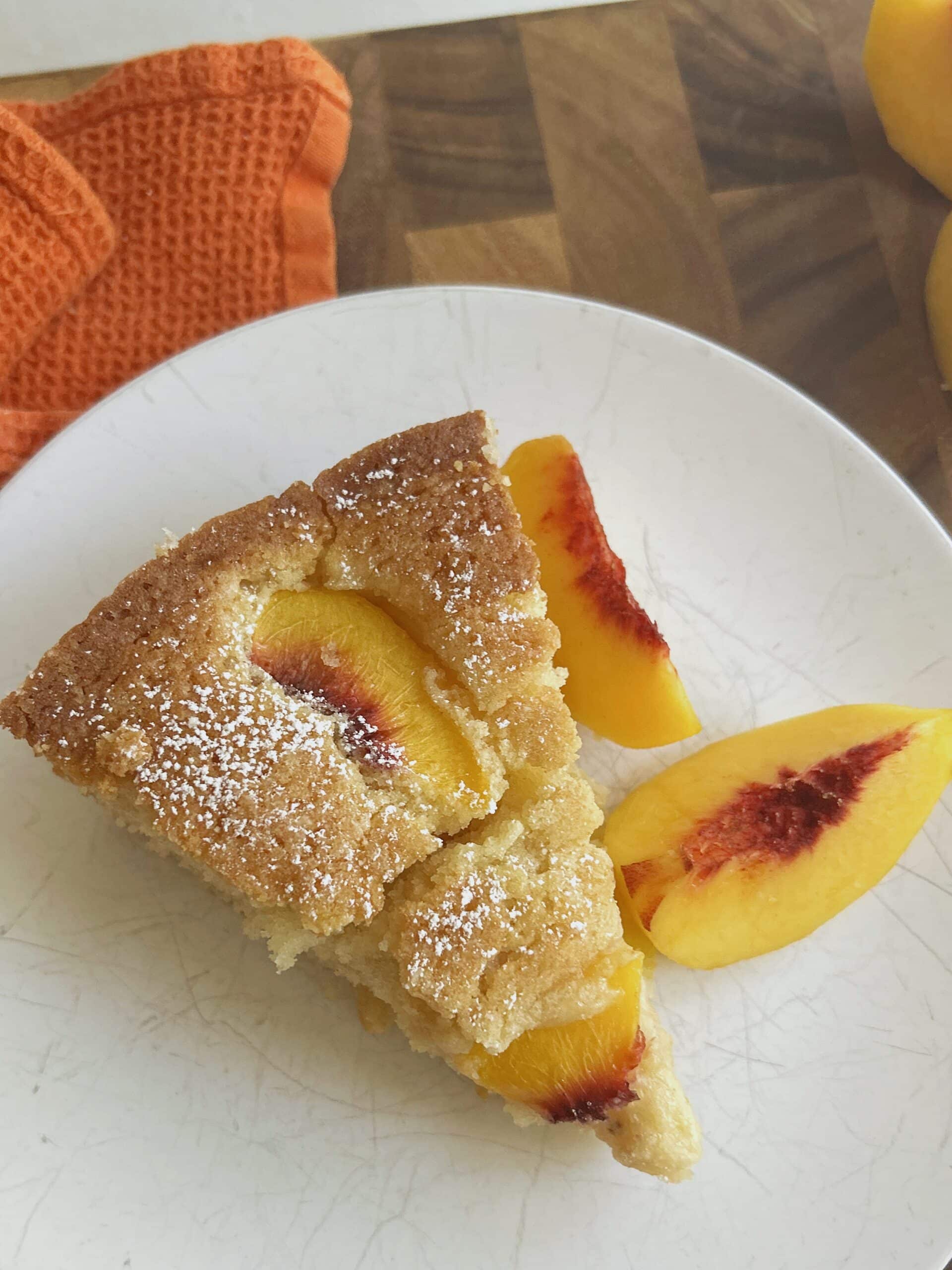 Slice of fresh peach cake.