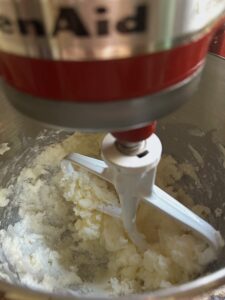 Cream together the butter and sugar for this peach cake recipe.