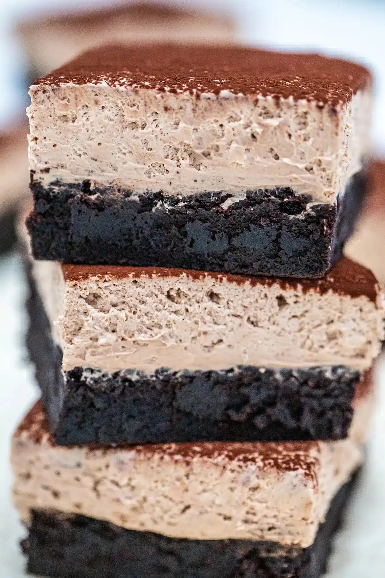 Stacked chocolate mousse brownies.