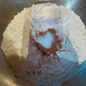 Heart shaped salt in cinnamon with the other dry ingredients in a bowl.