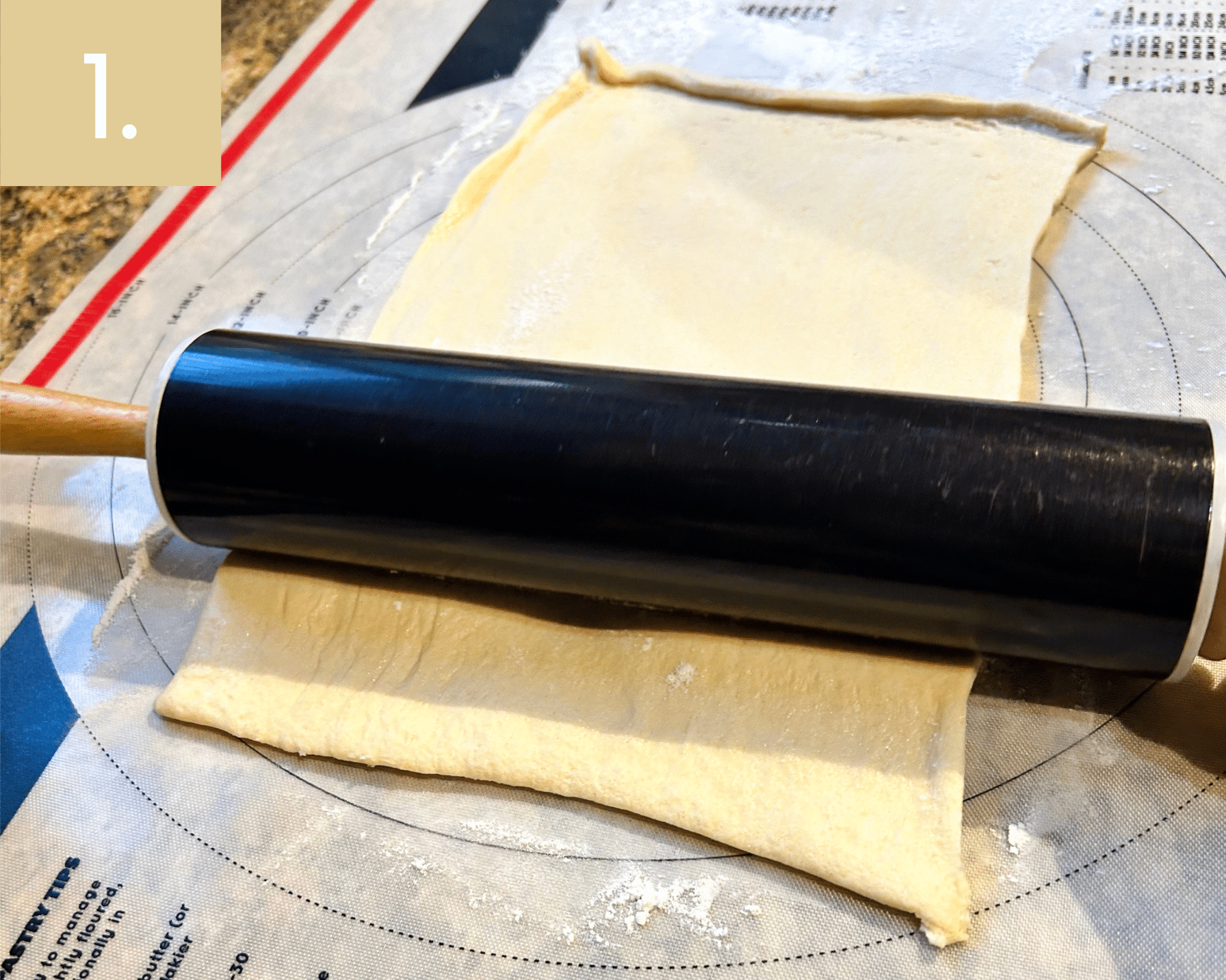 Rolling out crescent dough sheet into a rectangle for cinnamon sugar cruffins.