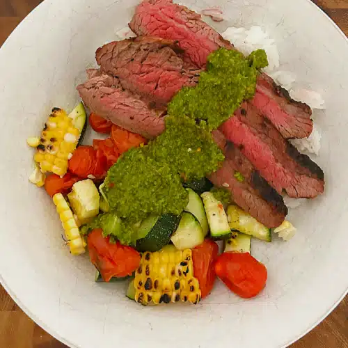 Trader Joe's Chimichurri Steak Recipe with Lemon Rice, Zucchini, Tomatoes, and fresh corn.
